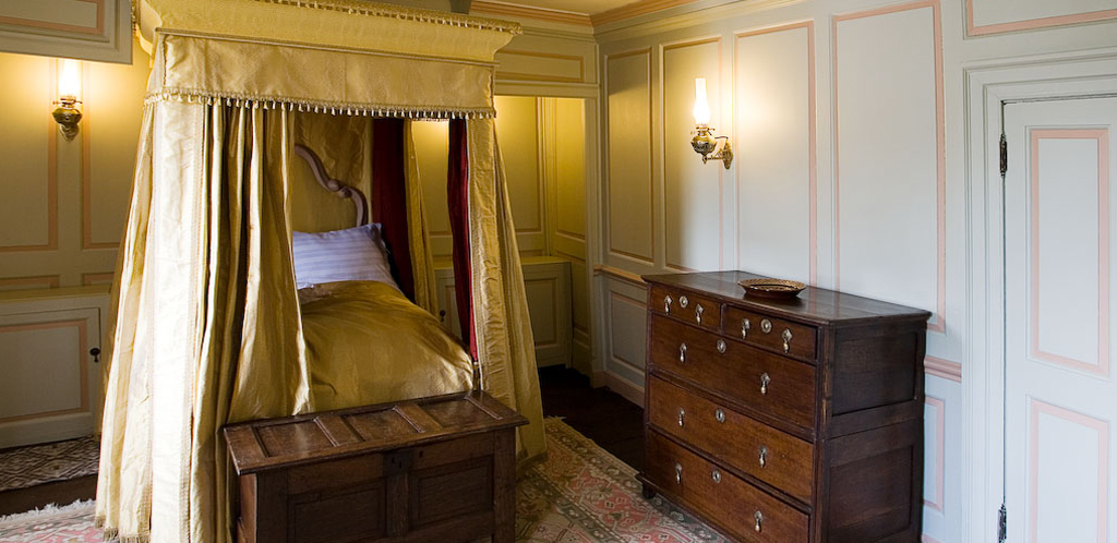 Our restored Georgian Bedchamber at Nantclwyd House (Georgian Period), with bed furnished in yellow silk