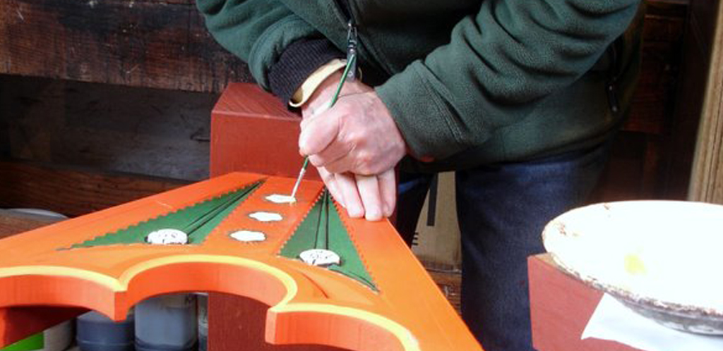 One of our craftsmen painting a trestle for the 1465 high table at Tretower Court